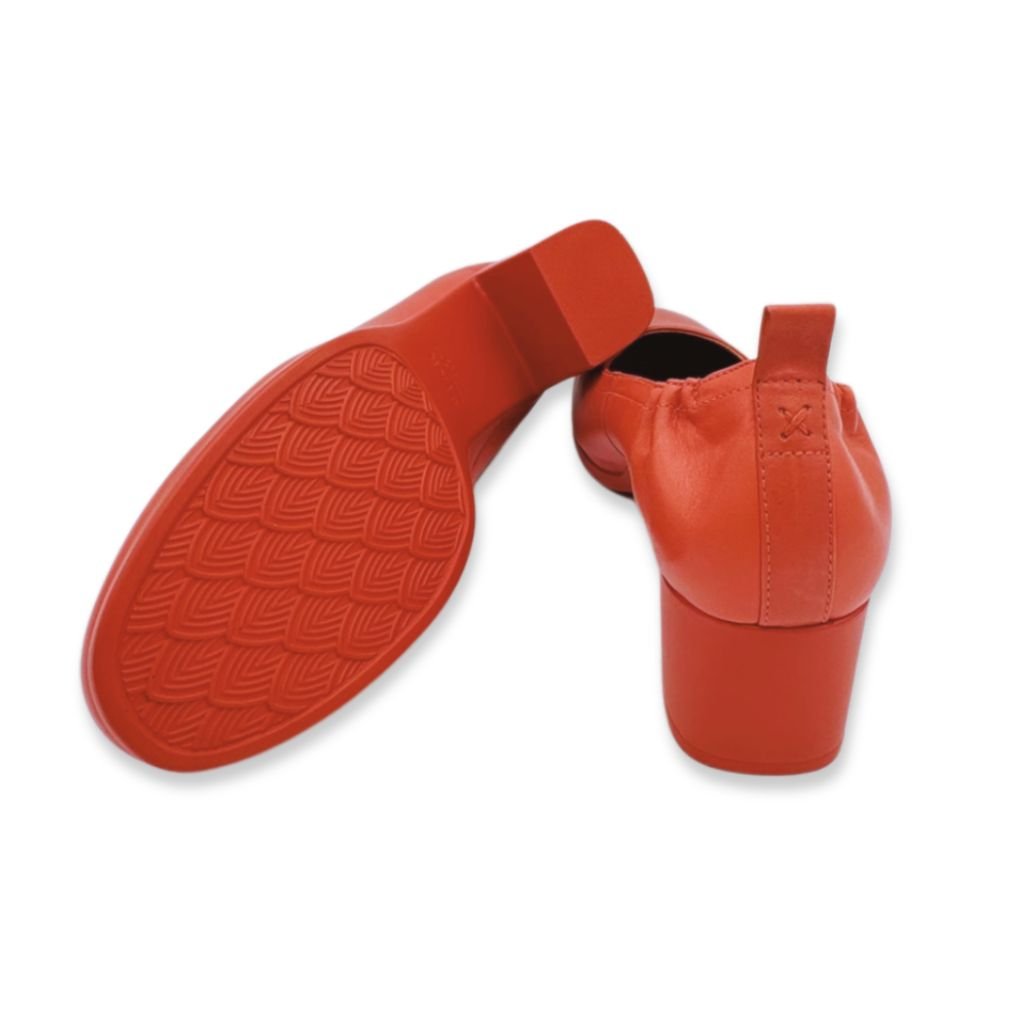 Close-up of non-slip tread and back view of Lava Red PIAR Performance Heels