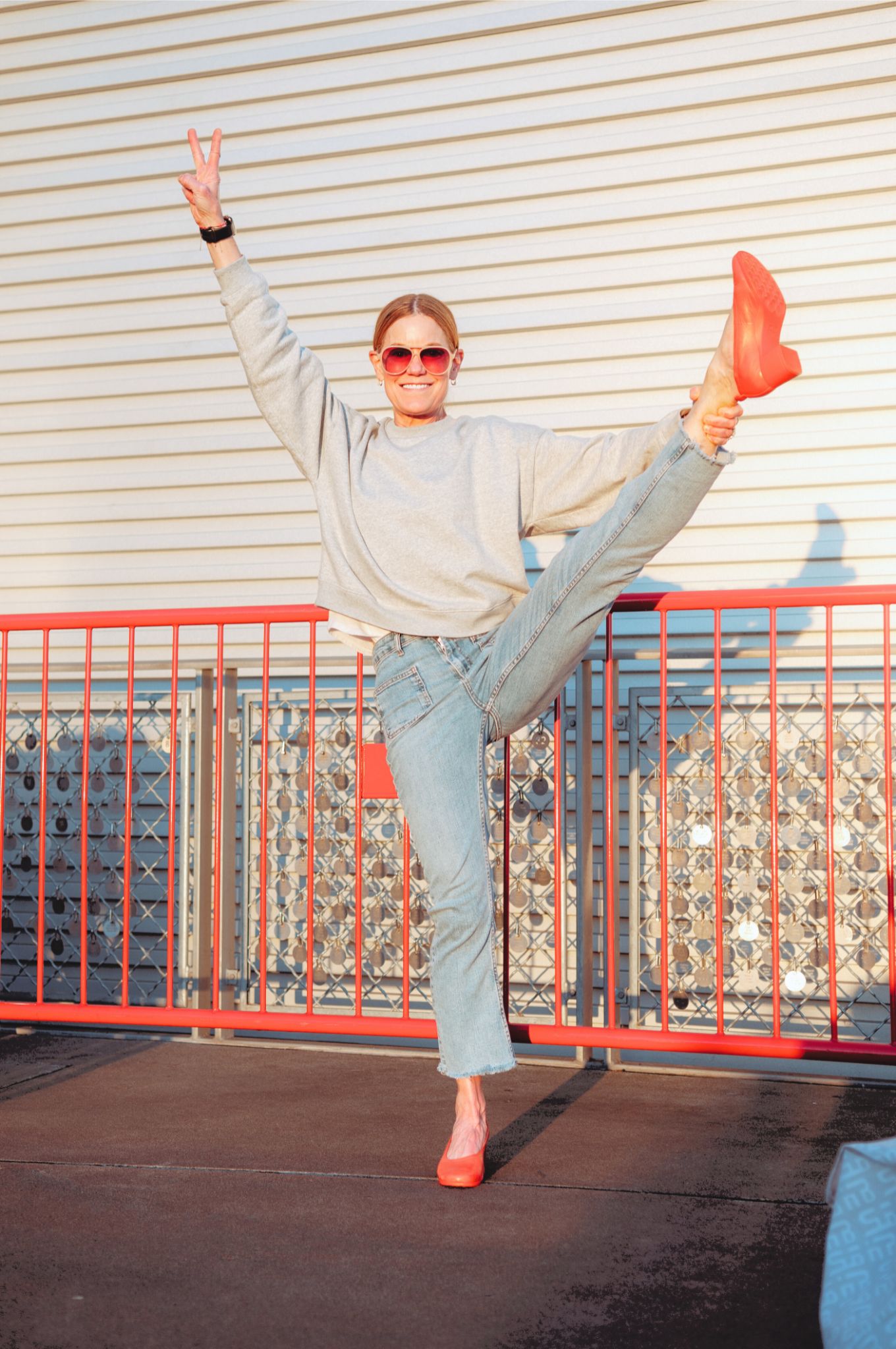 The Performance Heel by PIAR - Woman Wearing Stylish and Comfortable Red Leather Block Heels with One Leg In the Air