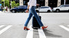 The Performance Heel by PIAR-Woman In Stylish and Comfortable Red Leather Block Heels Walking in Crosswalk with Luggage